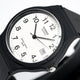 Reloj de cuarzo clásico unisex con esfera negra y correa de resina.