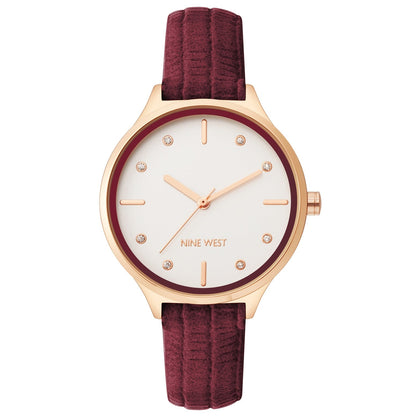 Nine West Damen Analog Quarzuhr mit roséfarbenem Metallgehäuse und Metallarmband, rosa Zifferblatt
