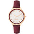 Nine West Damen Analog Quarzuhr mit roséfarbenem Metallgehäuse und Metallarmband, rosa Zifferblatt