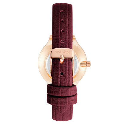 Nine West Damen Analog Quarzuhr mit roséfarbenem Metallgehäuse und Metallarmband, blaues Zifferblatt
