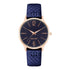 Nine West Damen Analog Quarzuhr mit roséfarbenem Metallgehäuse und Metallarmband, dunkelblaues Zifferblatt