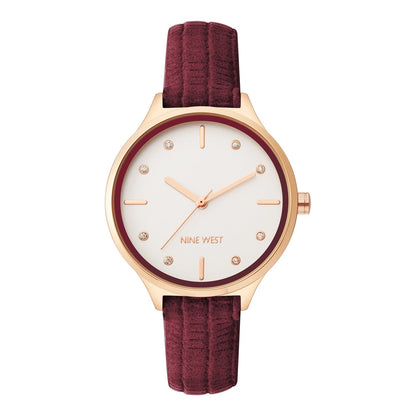Nine West Damen Analog Quarzuhr mit roséfarbenem Metallgehäuse und Metallarmband, rosa Zifferblatt