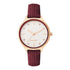 Nine West Damen Analog Quarzuhr mit roséfarbenem Metallgehäuse und Metallarmband, rosa Zifferblatt