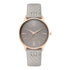 Nine West Damen Analog Quarzuhr mit silberfarbenem Metallgehäuse und Metallarmband, rosa Zifferblatt