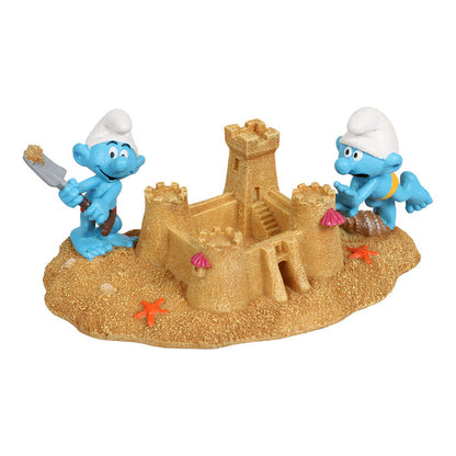 schluempfe bauen eine sandburg figur